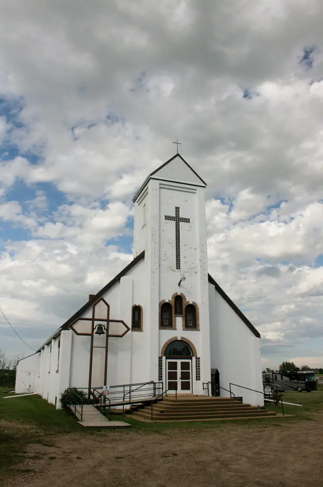 White church with bell and cross
